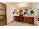 Bathroom featuring double sinks, vanity, and soaking tub, providing a spa-like experience at 1909 Alpine Dr, Erie, CO 80516