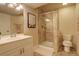Bathroom featuring a walk-in shower, framed art, vanity with ample storage, and a modern toilet at 1909 Alpine Dr, Erie, CO 80516