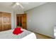 Bedroom featuring a neutral color, a closet, and an adjacent door at 1909 Alpine Dr, Erie, CO 80516
