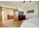 Spacious bedroom with an en-suite bathroom, walk-in closet, and contemporary artwork at 1909 Alpine Dr, Erie, CO 80516