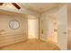 Bedroom featuring dresser and closet leading to bathroom, a peaceful and relaxing space at 1909 Alpine Dr, Erie, CO 80516