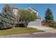 Charming two-story home with a well-maintained front yard and a gray two-car garage at 1909 Alpine Dr, Erie, CO 80516