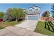 Charming two-story home with a well-maintained front yard and a gray two-car garage at 1909 Alpine Dr, Erie, CO 80516