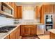 This gourmet kitchen includes gas range, granite counters, stainless appliances, and abundant cabinet space at 1909 Alpine Dr, Erie, CO 80516