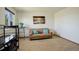 Cozy living room featuring a comfortable sofa, throw pillows, and an ocean view wall art at 1909 Alpine Dr, Erie, CO 80516