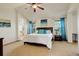 Inviting main bedroom with ensuite bath, large windows, and bright blue accents at 1909 Alpine Dr, Erie, CO 80516