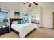 Spacious main bedroom with ensuite access, large windows, and comfortable bedding at 1909 Alpine Dr, Erie, CO 80516