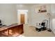 Home office space with large wooden desk, sitting area and bright sunlight at 1909 Alpine Dr, Erie, CO 80516