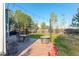 Outdoor patio with dining set, fire pit, string lights, and well-maintained lawn at 1909 Alpine Dr, Erie, CO 80516