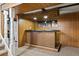 Basement wet bar with mirror and cabinetry at 1720 Pecos Way, Denver, CO 80221