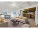 A finished basement with a pool table and a bar for entertaining and a lounge area with furniture at 1720 Pecos Way, Denver, CO 80221