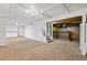 Basement with carpet, stairs and bar at 1720 Pecos Way, Denver, CO 80221