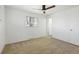 Empty bedroom featuring carpet floor, ceiling fan and neutral walls at 1720 Pecos Way, Denver, CO 80221