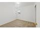Empty bedroom featuring neutral walls and carpeted floor at 1720 Pecos Way, Denver, CO 80221