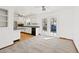 Dining Area, French Doors and view into kitchen at 1720 Pecos Way, Denver, CO 80221