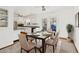Dining area with a view into the kitchen at 1720 Pecos Way, Denver, CO 80221