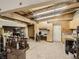Basement area features tile flooring, a work station, and ample storage cabinets at 1928 S Washington St, Denver, CO 80210