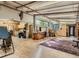 Large basement space with hardwood floors, a work area, and natural light from windows at 1928 S Washington St, Denver, CO 80210
