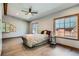 Comfortable bedroom with hardwood floors, large windows and fan at 1928 S Washington St, Denver, CO 80210