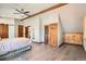 Cozy bedroom featuring hardwood floors, wood doors, good lighting and fan at 1928 S Washington St, Denver, CO 80210