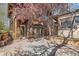 Charming courtyard with a mix of wood and stucco architecture, stone pavers, and mature trees for privacy at 1928 S Washington St, Denver, CO 80210