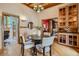Inviting dining room with wood floors, stylish furnishings, and convenient built-in cabinet at 1928 S Washington St, Denver, CO 80210