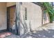 Charming building exterior with a secure iron gate, house numbers, and lush greenery for added character at 1928 S Washington St, Denver, CO 80210