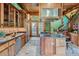 Spacious kitchen with wood cabinets, granite countertops, stainless steel appliances, and large island at 1928 S Washington St, Denver, CO 80210