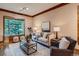 Comfortable living room with large windows, plush seating, and modern décor at 1928 S Washington St, Denver, CO 80210