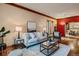 Cozy living room featuring hardwood floors, stylish furniture, and bright natural light at 1928 S Washington St, Denver, CO 80210
