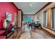 Spacious living room with hardwood floors, bright accent wall, and stylish furnishings at 1928 S Washington St, Denver, CO 80210