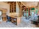 Office with built-in shelving, wooden desk, and views into living area with natural light at 1928 S Washington St, Denver, CO 80210