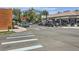 Street view of South Pearl Street with a pedestrian crossing and various shops at 1928 S Washington St, Denver, CO 80210