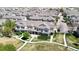 Community featuring well-maintained townhomes, sidewalks, and ample green space for outdoor enjoyment at 9758 Laredo St # 22D, Commerce City, CO 80022