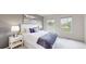 Bright bedroom with large windows, neutral carpet and walls, and a nicely made bed at 9758 Laredo St # 22D, Commerce City, CO 80022