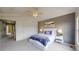 Bedroom featuring neutral colored walls, plush carpeting, and a well decorated queen bed at 9758 Laredo St # 22D, Commerce City, CO 80022