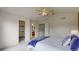 Bedroom features plush carpeting, neutral paint, a queen bed and access to en-suite bathroom and closet at 9758 Laredo St # 22D, Commerce City, CO 80022