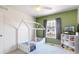 bedroom featuring house-shaped bed, ample natural light, and mountain decor at 9758 Laredo St # 22D, Commerce City, CO 80022