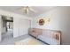 Bright bedroom featuring dual cribs and a closet at 9758 Laredo St # 22D, Commerce City, CO 80022