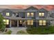 Charming townhome with stone accents, well-kept landscaping, and inviting front porches at 9758 Laredo St # 22D, Commerce City, CO 80022