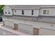 View of the exterior featuring multi-car garages at 9758 Laredo St # 22D, Commerce City, CO 80022