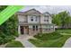 Charming two-story home with stone accents, a welcoming front porch, and well-maintained landscaping at 9758 Laredo St # 22D, Commerce City, CO 80022