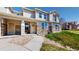 Inviting townhome with stone accents and lush landscaping in a well-maintained community at 9758 Laredo St # 22D, Commerce City, CO 80022