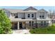 Inviting townhome with stone accents, a cozy porch, and well-maintained landscaping for curb appeal at 9758 Laredo St # 22D, Commerce City, CO 80022