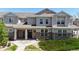 Charming townhome with stone accents, well-kept landscaping, and inviting front porches at 9758 Laredo St # 22D, Commerce City, CO 80022