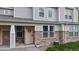 Inviting front entrance features stone accents, a decorative wreath, and a 'Welcome' mat at 9758 Laredo St # 22D, Commerce City, CO 80022
