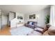 Comfortable living room with hardwood floors, ample seating, and modern decor accents at 9758 Laredo St # 22D, Commerce City, CO 80022