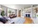 Open-concept living area flows into dining with hardwood floors and lots of natural light at 9758 Laredo St # 22D, Commerce City, CO 80022