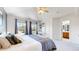Bright main bedroom with vaulted ceiling, dual windows, and ensuite bathroom access at 9758 Laredo St # 22D, Commerce City, CO 80022