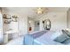 Spacious primary bedroom with decor shelves, ceiling fan, and ensuite bathroom entrance at 9758 Laredo St # 22D, Commerce City, CO 80022